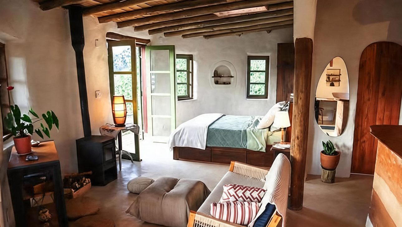 Quarto com fogão a lenha e vista